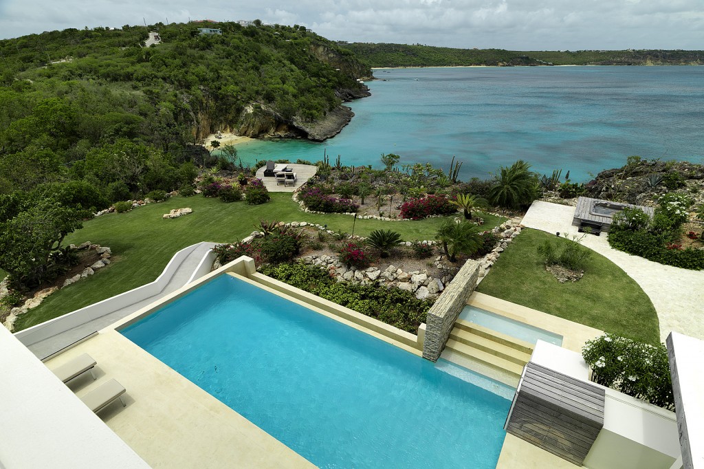 View from a bedroom overlooking the swimming pool, jacuzzi, gardens and the Caribbean