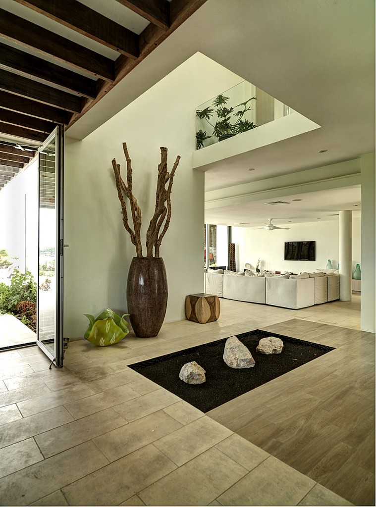 The entrance foyer with view of the bedrooms levels above and living area below