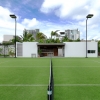 3-grass-tennis-court-modern-caribbean-home