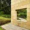 7-domaine-d-emeraude-limestone-wall-window-garden-path