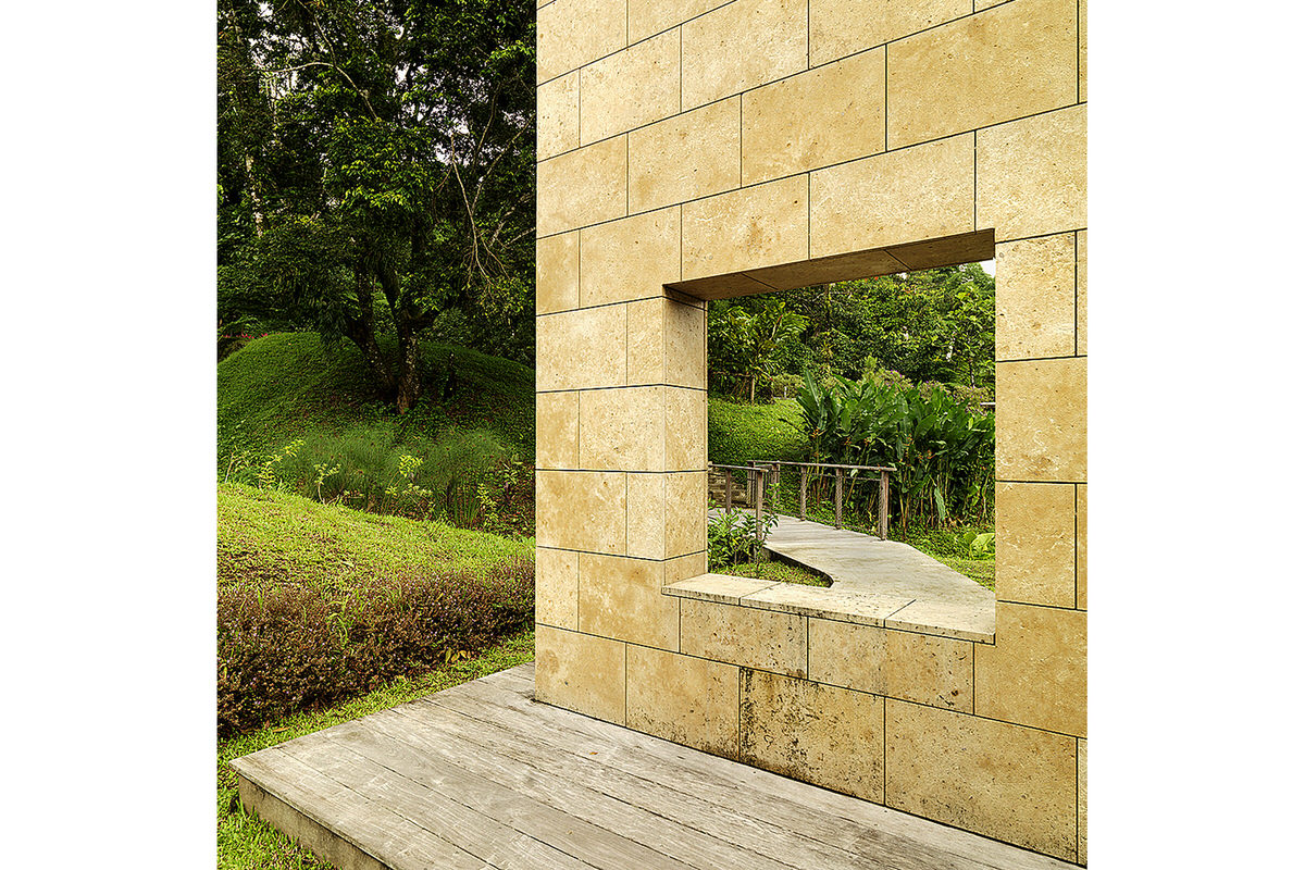 7-domaine-d-emeraude-limestone-wall-window-garden-path