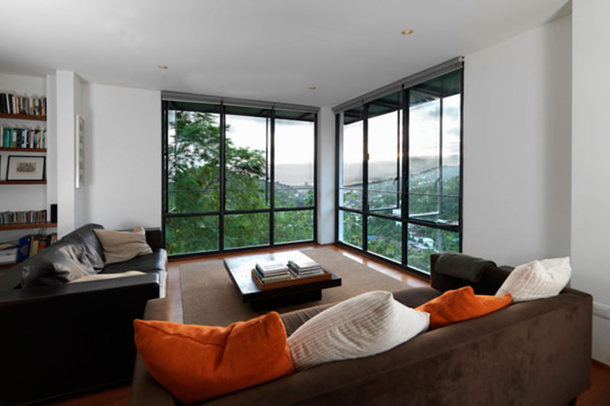 4-living-room-corner-windows-modern-caribbean-home_Raymond_Residence